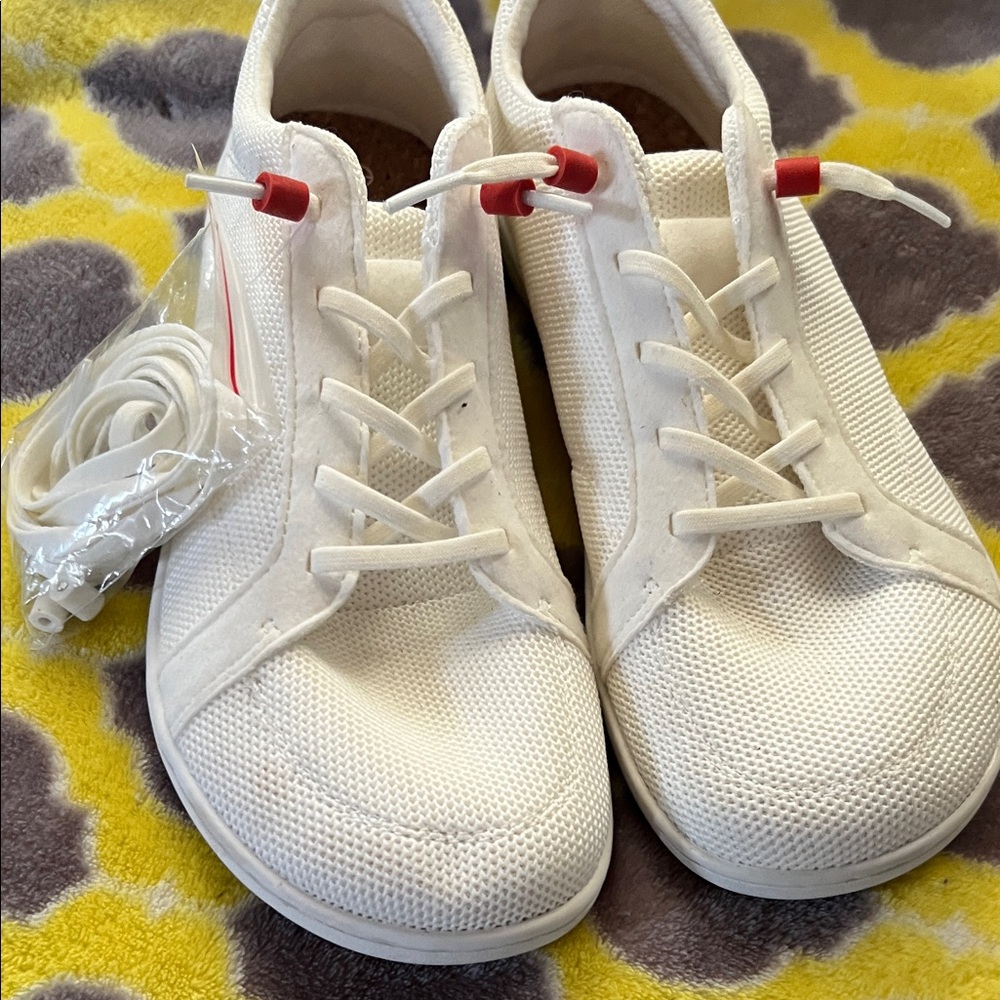 Stylish White Sneakers with Red Accents